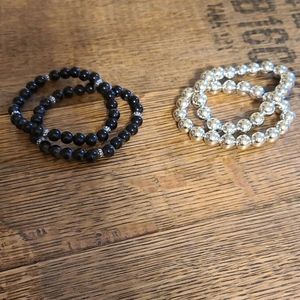 Silver and black bracelets